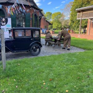 1940s event at avoncrfort museum. The counting house with black ford car bunting and soldiers by a table