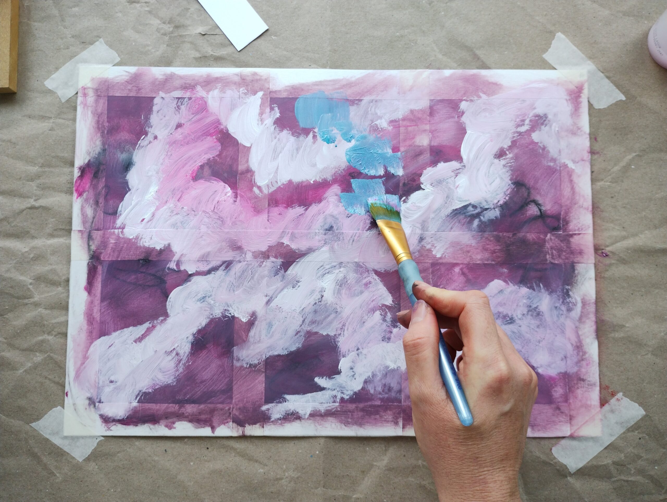 A person painting an abstract image